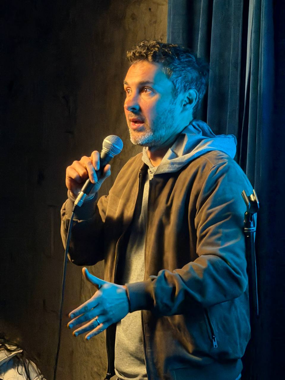 Stand-up comedian performing at SESH Comedy