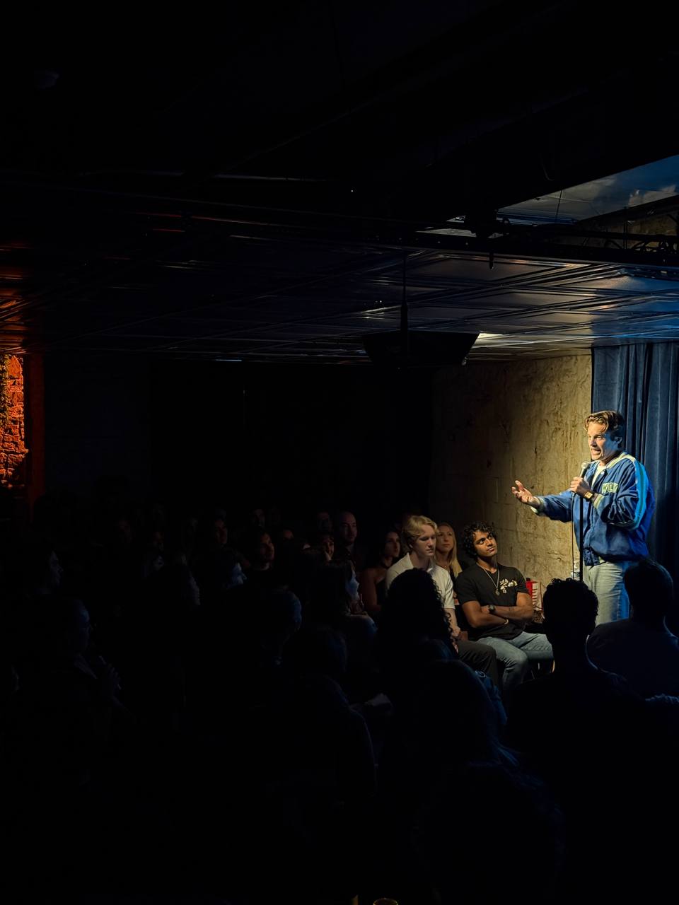 Comedian on stage at SESH Comedy